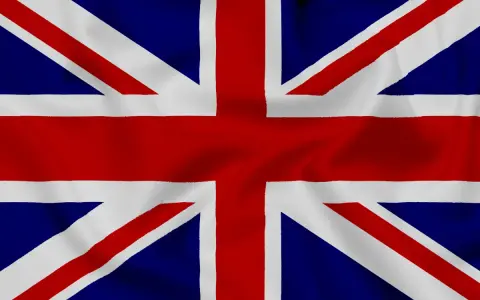 Flaga Wielkiej Brytanii, Union Jack, z widocznymi fałdami materiału.